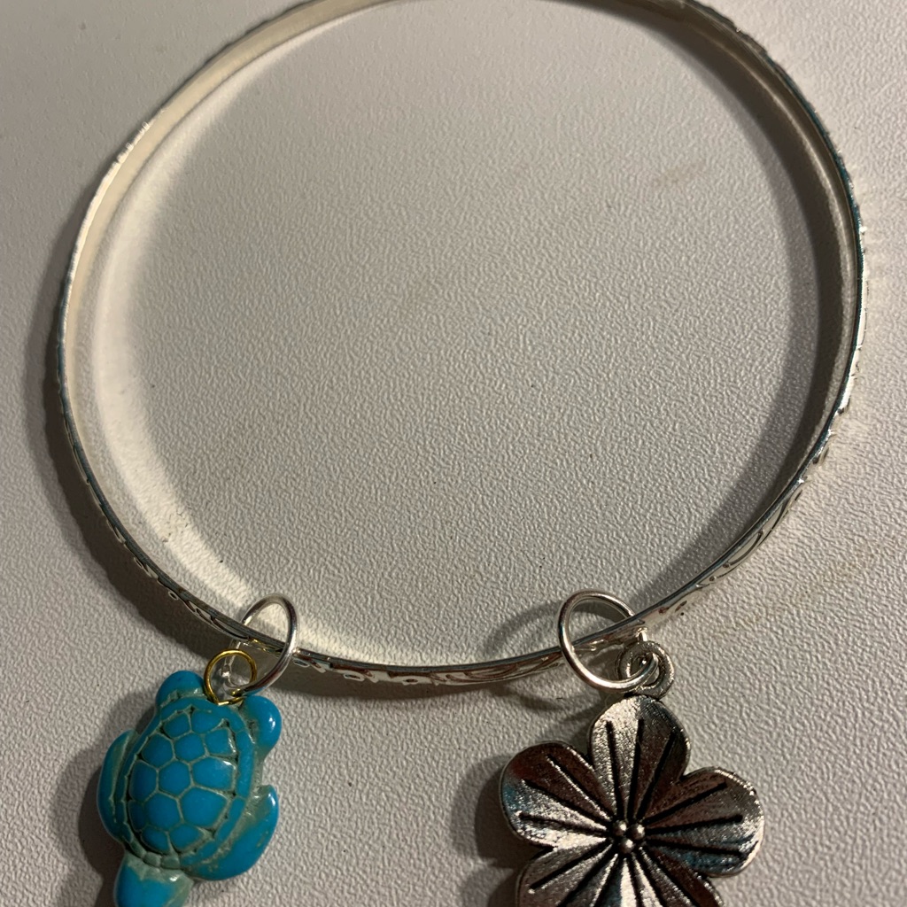 Silver Bangle With Blue Turtle And Silver Flower Charms